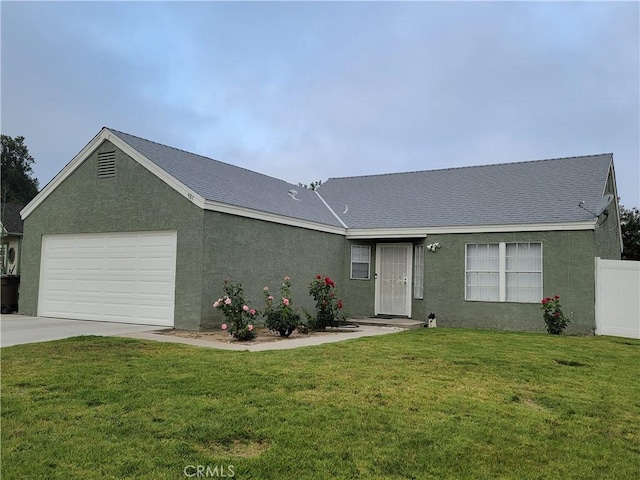 983 Orchard Ln, Colton, CA 92324 - ranch-style house featuring a garage, stucco siding, driveway, and a shingled roof