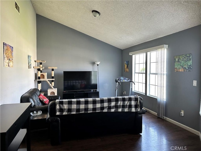 983 Orchard Ln, Colton, CA 92324 - living room with vaulted ceiling, wood finished floors, and a textured ceiling