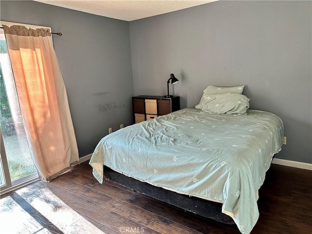 983 Orchard Ln, Colton, CA 92324 - bedroom featuring hardwood / wood-style flooring and a textured ceiling
