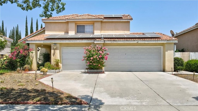 1808 Cave St, Redlands, CA 92374 - view of front of property with roof mounted solar panels, stucco siding, driveway, and a tile roof