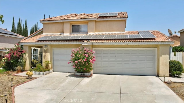 1808 Cave St, Redlands, CA 92374 - mediterranean / spanish home with solar panels, a tile roof, stucco siding, and concrete driveway