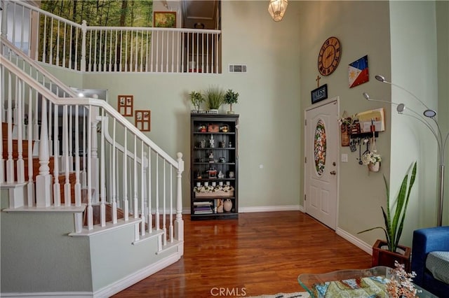 1808 Cave St, Redlands, CA 92374 - entrance foyer featuring a towering ceiling, stairway, and wood finished floors