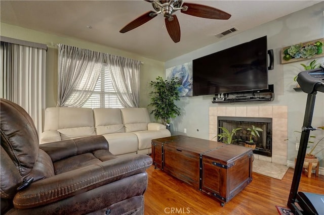 1808 Cave St, Redlands, CA 92374 - living room featuring wood finished floors, a fireplace, and ceiling fan