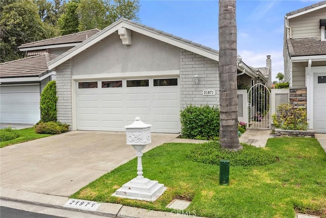 21971 Cayuga Ln N, Lake Forest, CA 92630 - view of front of property featuring a garage, driveway, a gate, a front yard, and stucco siding