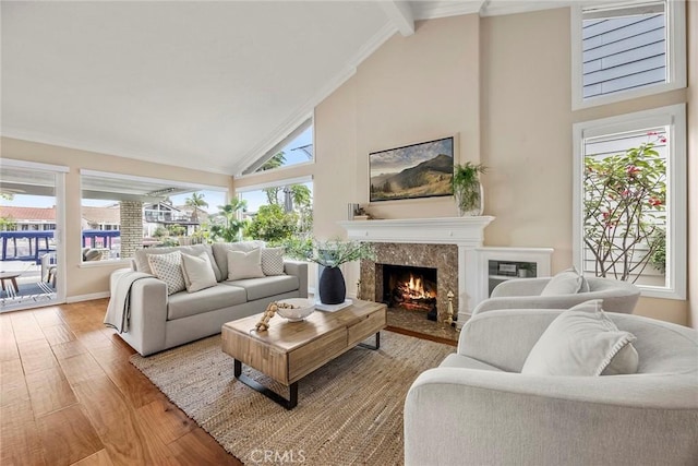 21971 Cayuga Ln N, Lake Forest, CA 92630 - living area with high vaulted ceiling, wood finished floors, a fireplace, and beam ceiling