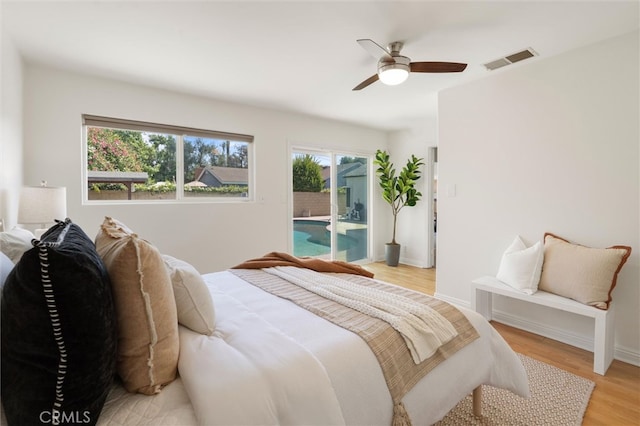 2370 Argonne Ave, Long Beach, CA 90815 - bedroom with access to exterior, light wood-type flooring, and a ceiling fan