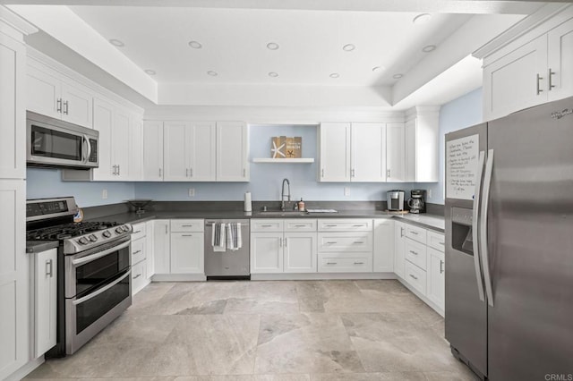 4265 Spoon Bill Way, Oceanside, CA 92057 - kitchen with stainless steel appliances, open shelves, dark countertops, and white cabinets