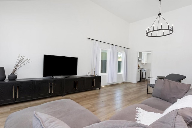 4576 Mariners Bay, Oceanside, CA 92057 - living room with a chandelier, light wood-type flooring, and high vaulted ceiling