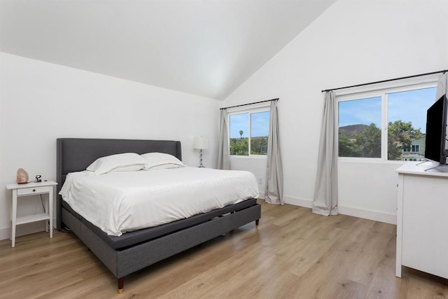 4576 Mariners Bay, Oceanside, CA 92057 - bedroom with light wood-style flooring and high vaulted ceiling