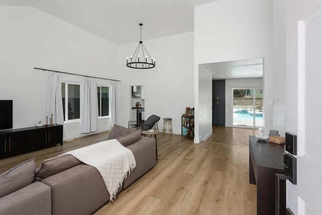 4576 Mariners Bay, Oceanside, CA 92057 - living room with light wood-style floors, a chandelier, and high vaulted ceiling