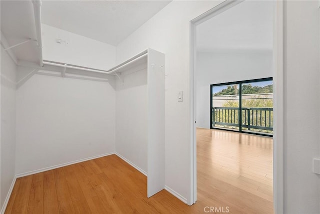 13012 Valleyheart Dr Unit 8, Studio City, CA 91604 - walk in closet featuring wood finished floors