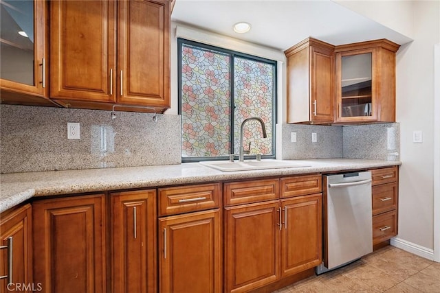 13012 Valleyheart Dr Unit 8, Studio City, CA 91604 - kitchen featuring stainless steel dishwasher, brown cabinetry, and glass insert cabinets