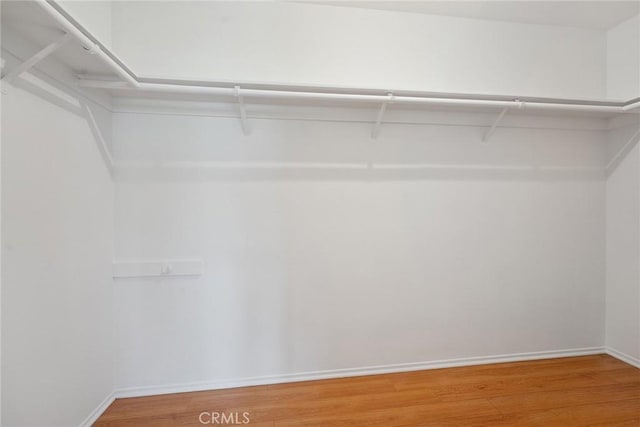 13012 Valleyheart Dr Unit 8, Studio City, CA 91604 - walk in closet featuring wood finished floors