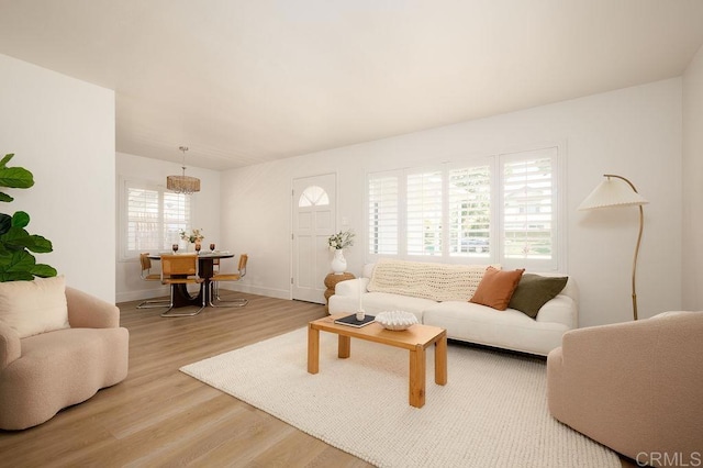 1713 Stewart St, Oceanside, CA 92054 - living room featuring wood finished floors and baseboards