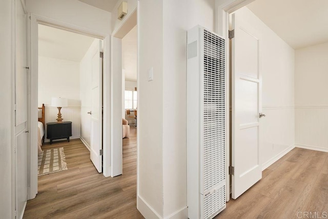 1713 Stewart St, Oceanside, CA 92054 - corridor featuring wood finished floors and a heating unit