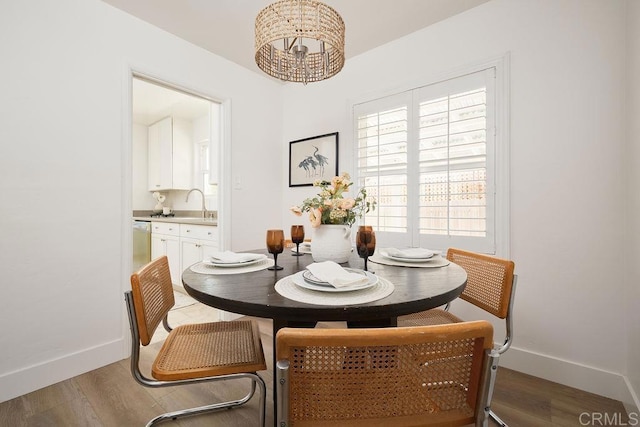 1713 Stewart St, Oceanside, CA 92054 - dining space featuring a chandelier and light wood-type flooring
