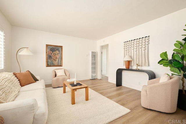 1713 Stewart St, Oceanside, CA 92054 - living room with a heating unit and light wood-type flooring