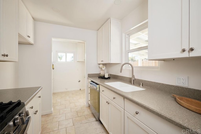 1713 Stewart St, Oceanside, CA 92054 - kitchen featuring appliances with stainless steel finishes and white cabinetry