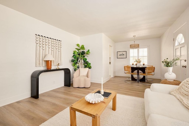 1713 Stewart St, Oceanside, CA 92054 - living area featuring light wood-style flooring and baseboards
