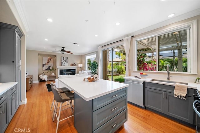 2 Corte Arbertura, San Clemente, CA 92673 - kitchen featuring stainless steel dishwasher, gray cabinetry, light wood-style floors, light countertops, and recessed lighting