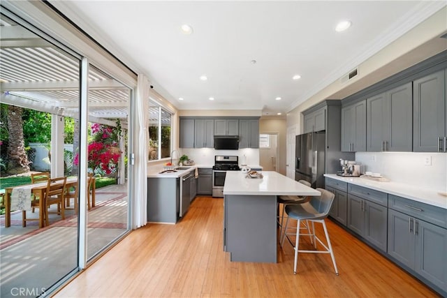 2 Corte Arbertura, San Clemente, CA 92673 - kitchen with stainless steel appliances, gray cabinets, crown molding, healthy amount of natural light, and recessed lighting
