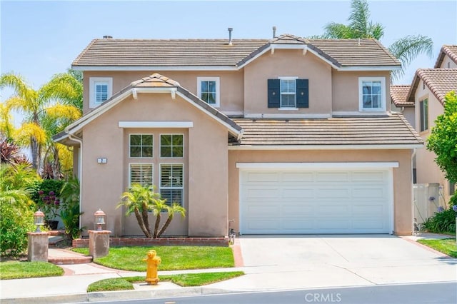 2 Corte Arbertura, San Clemente, CA 92673 - traditional home featuring driveway, an attached garage, and stucco siding