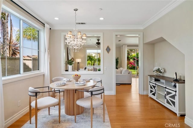 2 Corte Arbertura, San Clemente, CA 92673 - dining room featuring healthy amount of natural light, light wood-style floors, a chandelier, ornamental molding, and recessed lighting