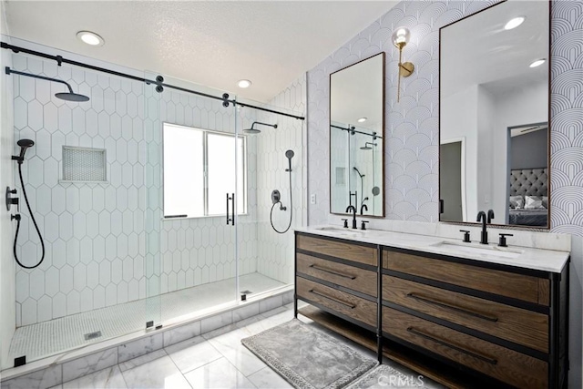 17733 Willow Dr, Riverside, CA 92503 - ensuite bathroom with a shower stall, double vanity, wallpapered walls, marble look tiles, and recessed lighting