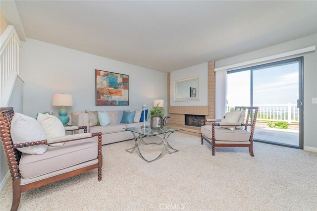 1229 Porto Grande Unit 4, Diamond Bar, CA 91765 - carpeted living room with a brick fireplace and baseboards