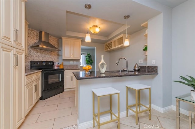 1229 Porto Grande Unit 4, Diamond Bar, CA 91765 - kitchen with electric range, wall chimney range hood, a tray ceiling, a peninsula, and light tile patterned flooring