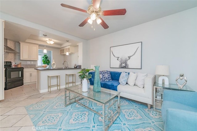 1229 Porto Grande Unit 4, Diamond Bar, CA 91765 - living area with light tile patterned floors, ceiling fan, and a tray ceiling