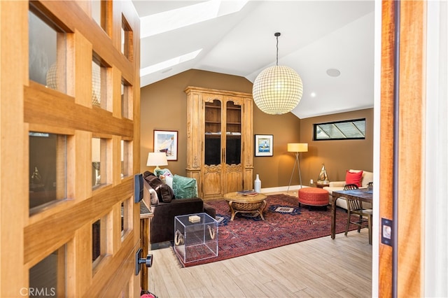 5429 E The Toledo, Long Beach, CA 90803 - living area with a skylight, wood finished floors, vaulted ceiling, and a chandelier