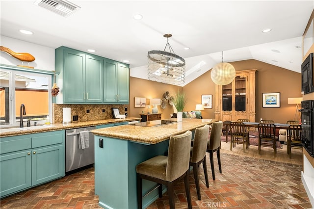 5429 E The Toledo, Long Beach, CA 90803 - kitchen with black appliances, a center island, brick floors, a breakfast bar area, and lofted ceiling