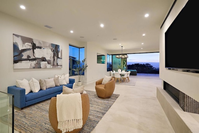 537 N Granados Ave, Solana Beach, CA 92075 - living area featuring recessed lighting, a chandelier, and a fireplace with raised hearth