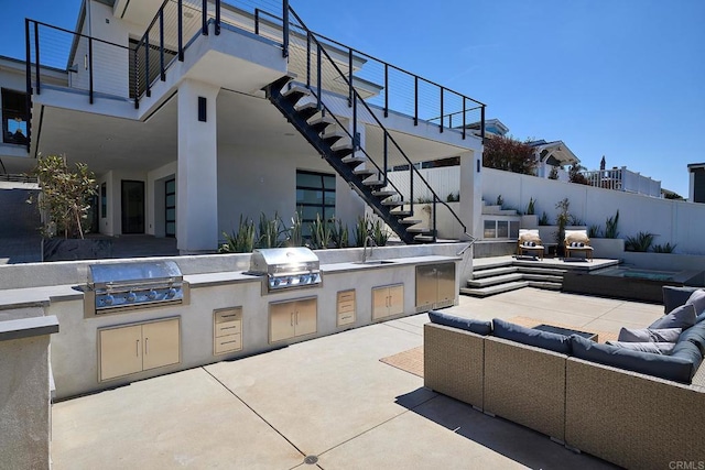 537 N Granados Ave, Solana Beach, CA 92075 - view of patio featuring outdoor lounge area, stairs, and an outdoor kitchen