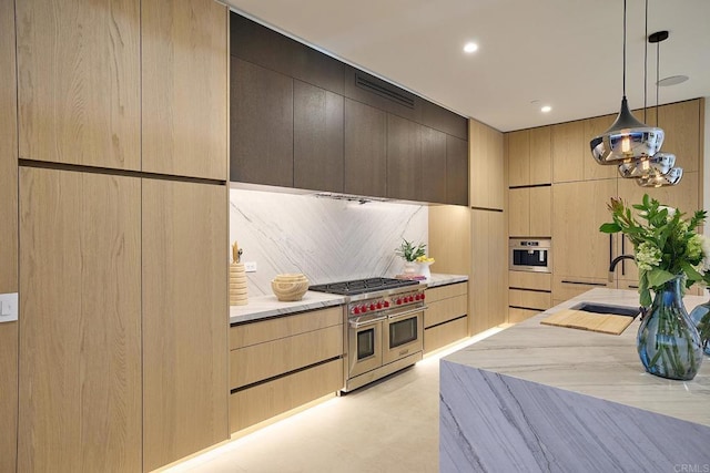 537 N Granados Ave, Solana Beach, CA 92075 - kitchen with range with two ovens, light brown cabinetry, modern cabinets, decorative light fixtures, and recessed lighting