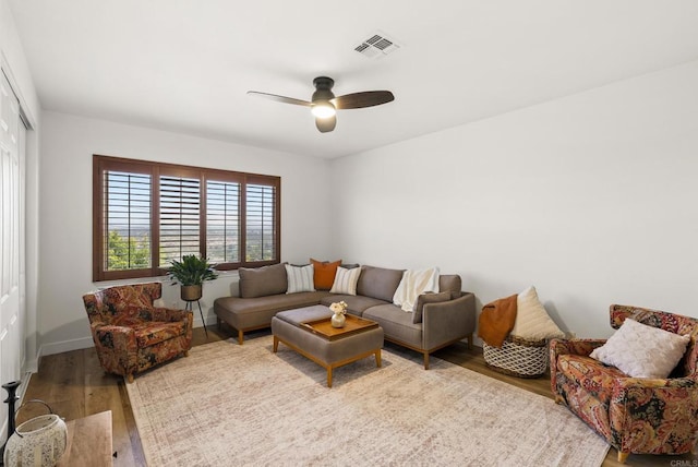 6774 Caurina Ct, Carlsbad, CA 92011 - living room with wood finished floors and a ceiling fan