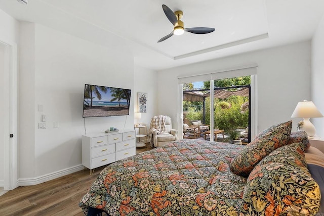 6774 Caurina Ct, Carlsbad, CA 92011 - bedroom with wood finished floors, access to exterior, ceiling fan, and a raised ceiling