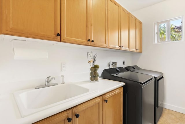 6774 Caurina Ct, Carlsbad, CA 92011 - washroom featuring cabinet space, washing machine and clothes dryer, and light tile patterned floors