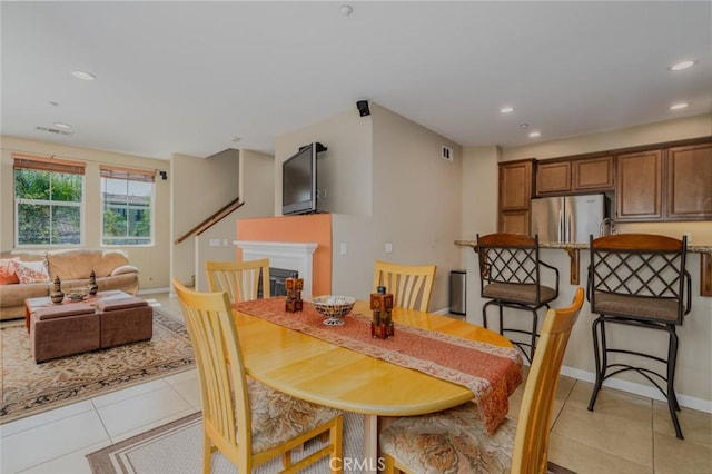 8036 Picasso, Stanton, CA 90680 - dining room featuring light tile patterned flooring, recessed lighting, and a fireplace
