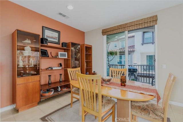 8036 Picasso, Stanton, CA 90680 - dining space with light tile patterned flooring and baseboards