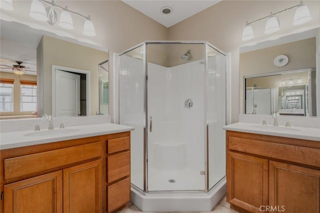 8036 Picasso, Stanton, CA 90680 - full bath with a shower stall, ceiling fan, and two vanities