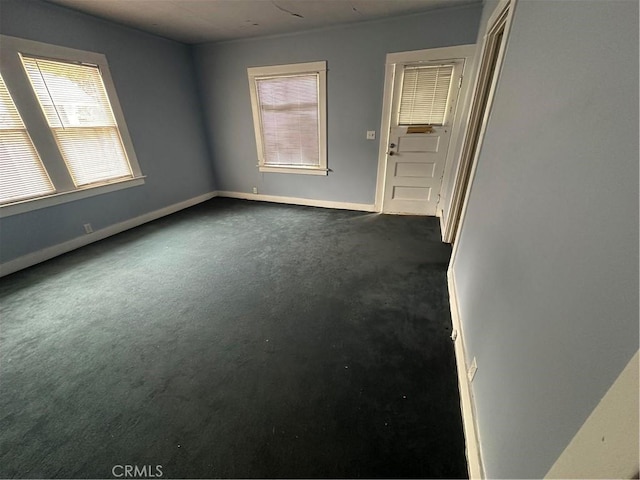 1116 S Barrington Ave, Los Angeles, CA 90049 - unfurnished room with dark colored carpet and baseboards