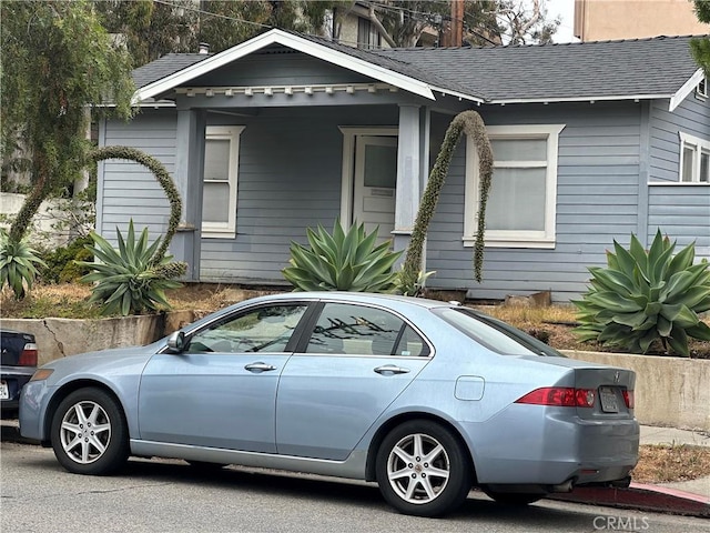 1116 S Barrington Ave, Los Angeles, CA 90049 - view of front facade with a shingled roof