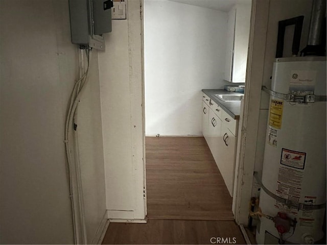 1116 S Barrington Ave, Los Angeles, CA 90049 - hall with secured water heater and wood finished floors
