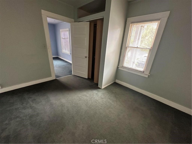 1116 S Barrington Ave, Los Angeles, CA 90049 - unfurnished bedroom with dark colored carpet and a closet