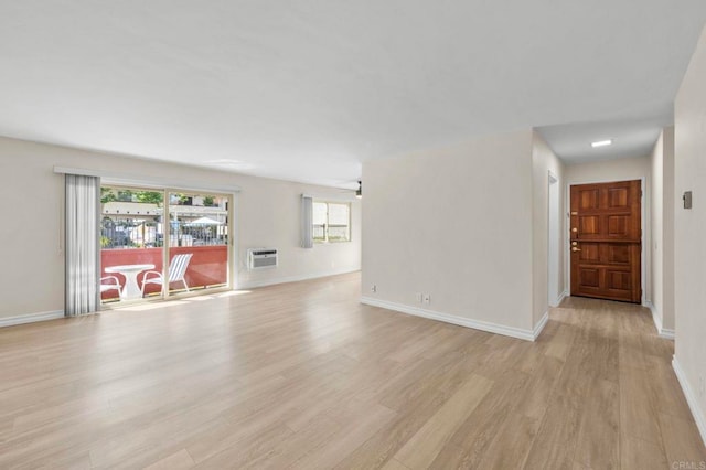 8649 Lake Murray Blvd Unit 4, San Diego, CA 92119 - unfurnished living room with light wood-style flooring and a wall mounted air conditioner