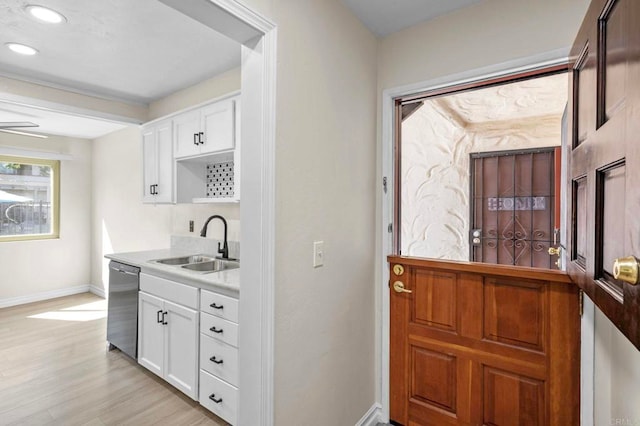 8649 Lake Murray Blvd Unit 4, San Diego, CA 92119 - kitchen featuring stainless steel dishwasher, light countertops, white cabinetry, light wood-style flooring, and recessed lighting