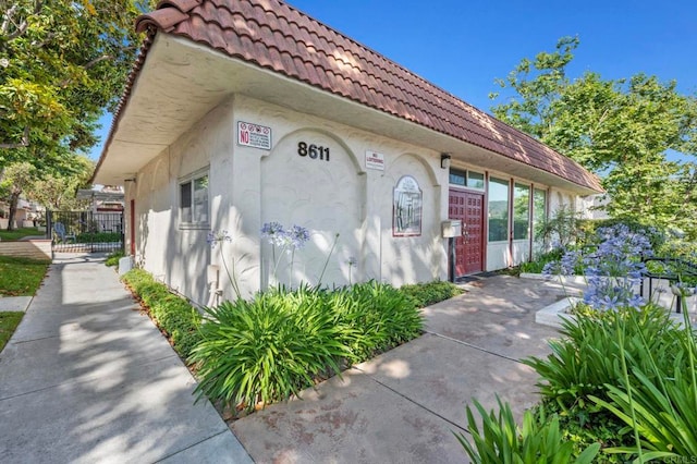 8649 Lake Murray Blvd Unit 4, San Diego, CA 92119 - view of side of home with stucco siding and a tiled roof