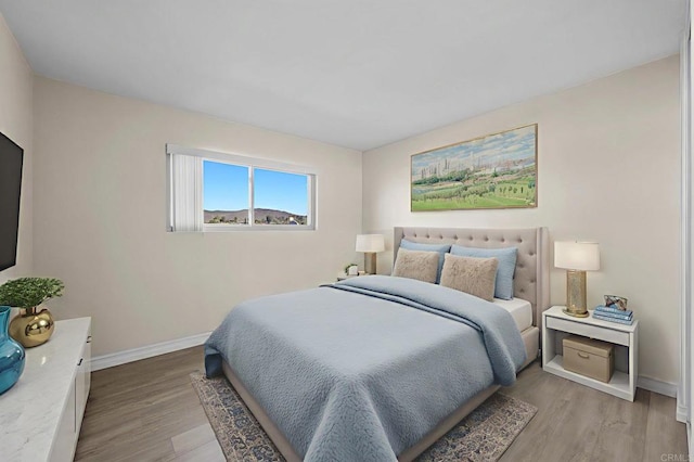 8649 Lake Murray Blvd Unit 4, San Diego, CA 92119 - bedroom featuring baseboards and light wood-style flooring